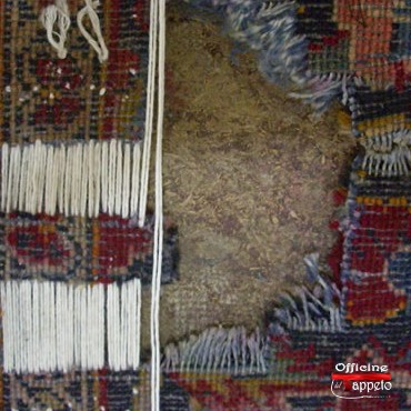 Avanzamento dei lavori di orditura di un tappeto Kashan